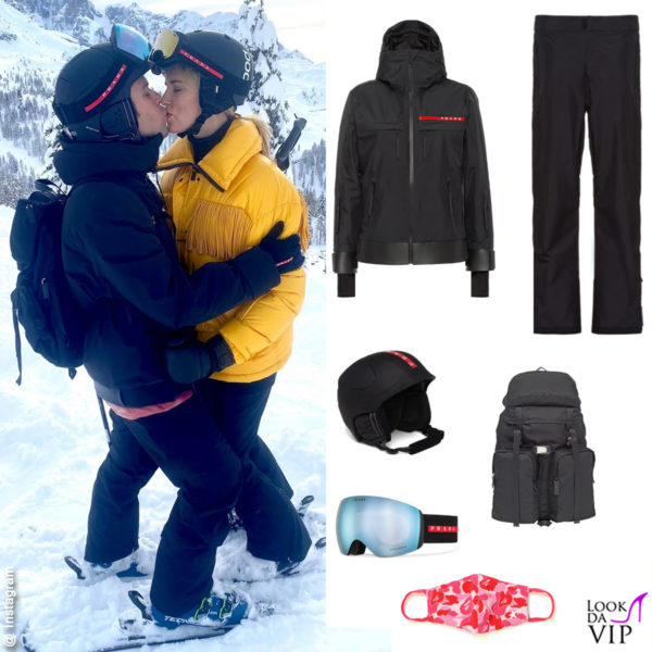 outfit Prada: giacca (2.100 euro), pantaloni (1.150 euro), casco (550 euro), maschera (400 euro), zaino (1.300 euro). Maschera per bocca Bape (65 euro)