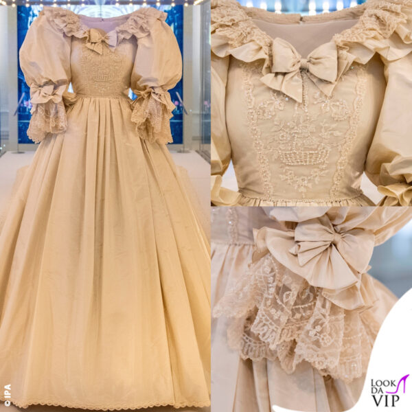 L'abito è una creazione di David ed Elizabeth Emmanuel, in taffetà di seta color avorio impreziosita da oltre 10mila tra perle e paillettes