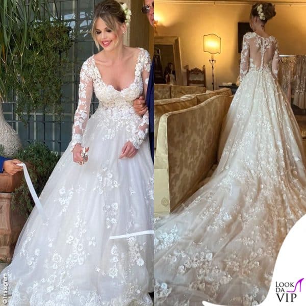 Per il rito civile e i festeggiamenti sul Lago di Bracciano, Carlotta ha scelto un abito da principessa in pizzo Paola D'Onofrio