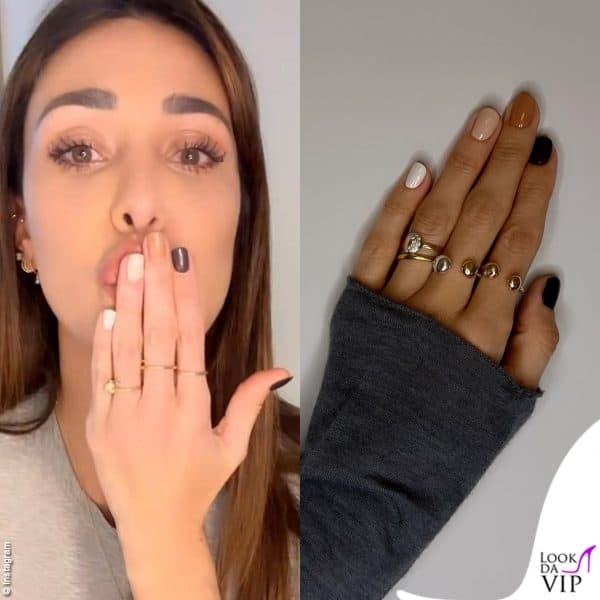 Belen Rodriguez cambia smalto per ogni dito, scegliendo colori autunnali