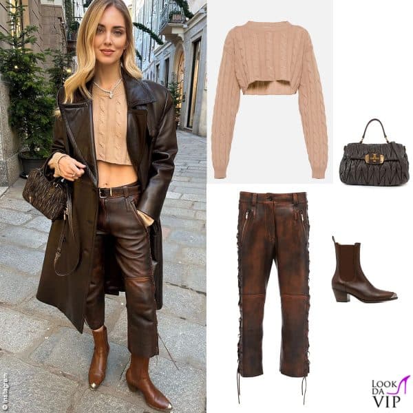 Per la passeggiata sceglie crop top, pantaloni e borsa Miu Miu, trench Prada e stivali Ralph Lauren