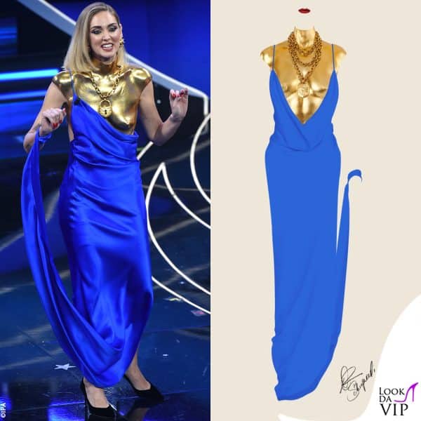 il primo outfit è comporto da un abito blu con busto anatomico oro 