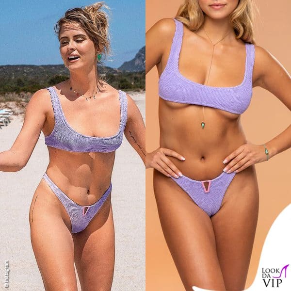 Sexy e femminile in spiaggia con il bikini lilla