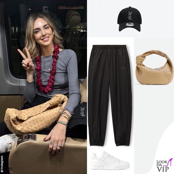 il look da viaggio: maglia Intimissimi, pantaloni Alexander Wang, borsa Bottega Veneta, cappello Saint Laurent, sneakers Louis Vuitton 