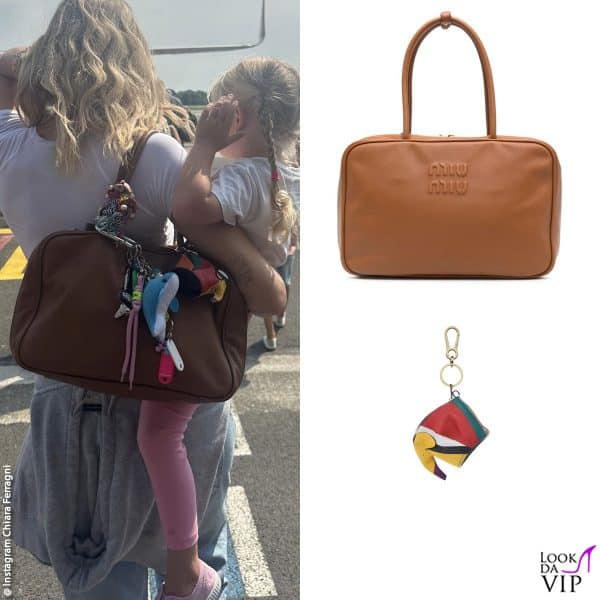 Chiara in partenza da Milano con Vittoria in braccio (borsa Miu Miu, portamonete Loewe) 