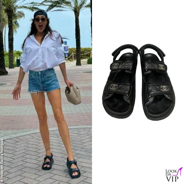 Cecilia sotto il sole della florida con camicia bianca e short in jeans, ai piedi comodi sandali Chanel