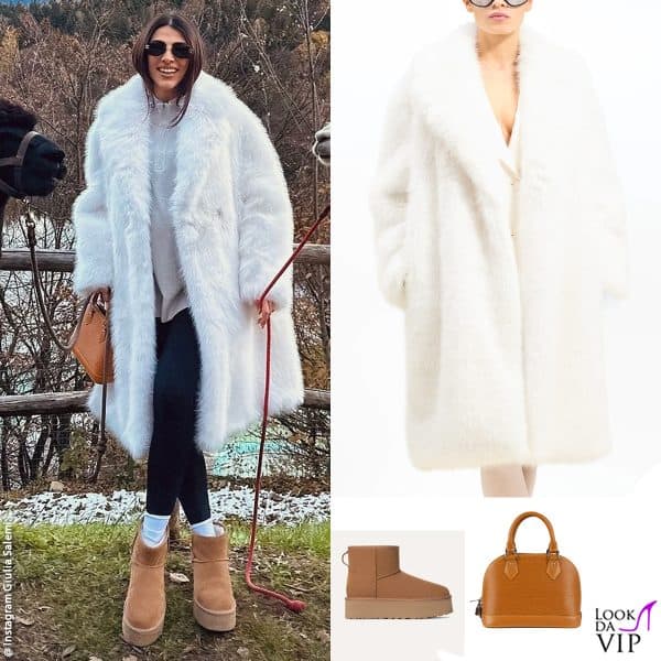 nella natura con un cappotto BB Couture, borsa Louis Vuitton e stivali Ugg 