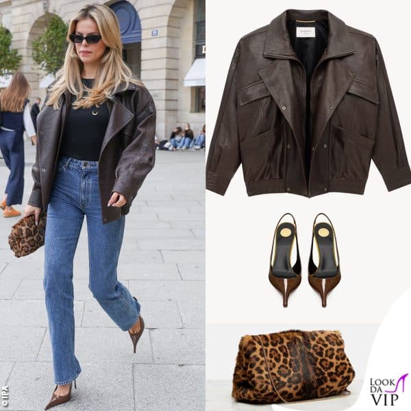 Giacca e accessori Saint Laurent: il look include anche un piercing sulla maglia, ad altezza capezzolo